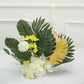 Green and gold artificial jungle theme palm leaves arrangement.