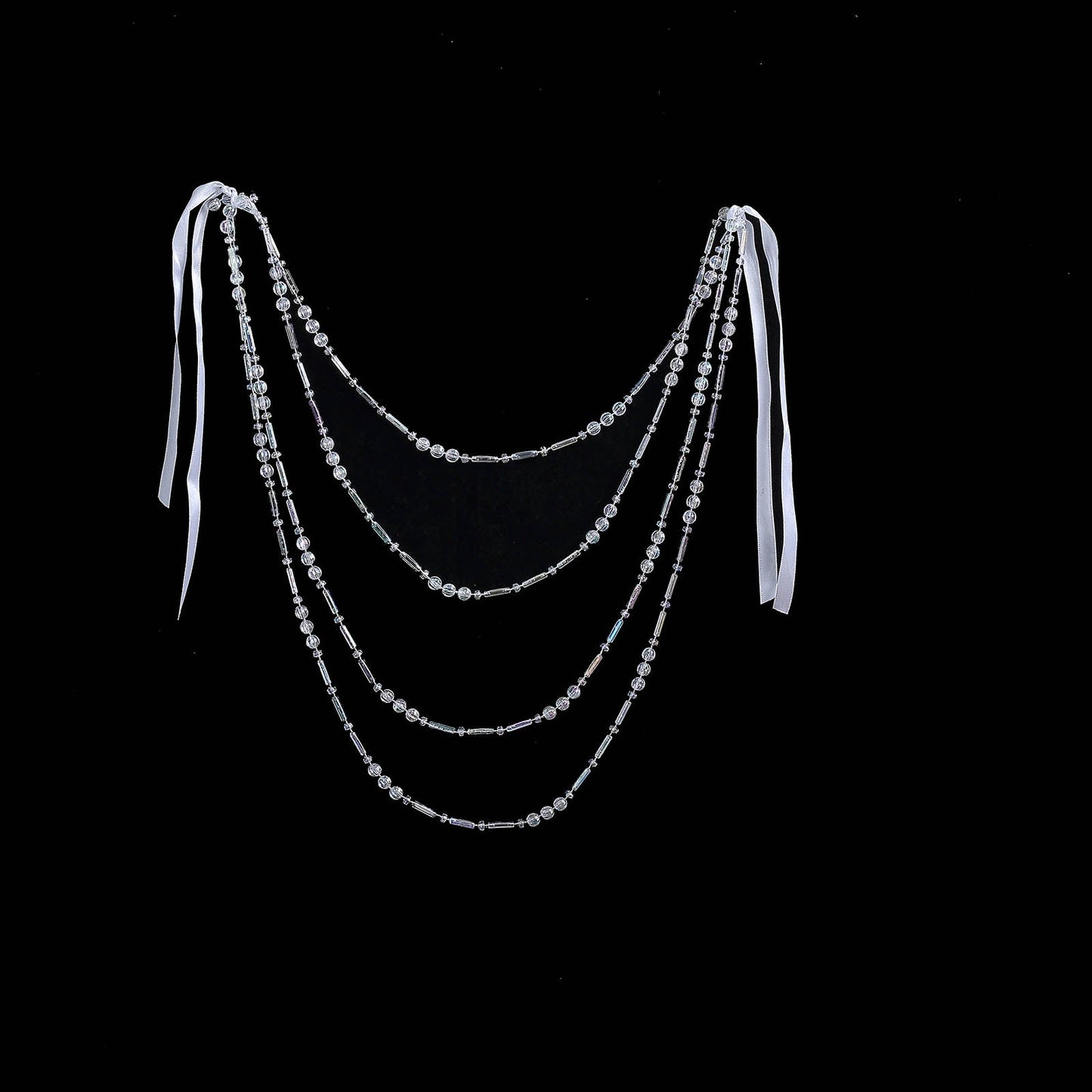 Iridescent faux pearl beaded chair back garland with ribbons.