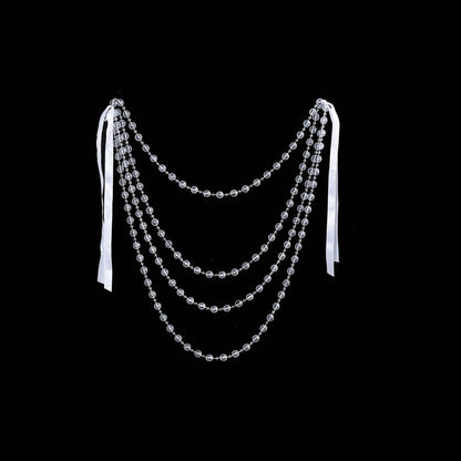 Clear faux pearl beaded chair back garland sash for wedding decor.