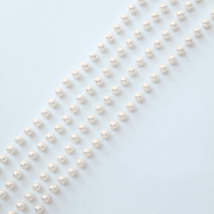 Ivory faux pearl beaded garland for wedding chair decor.