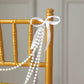 White faux pearl beaded garland for wedding chair decor.