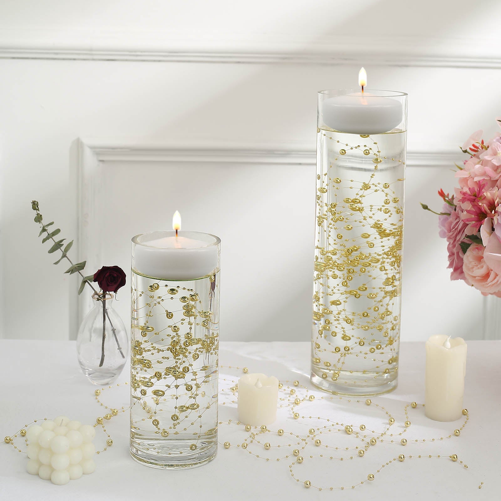 Gold vase filler for floating candles in elegant table centerpiece decor.