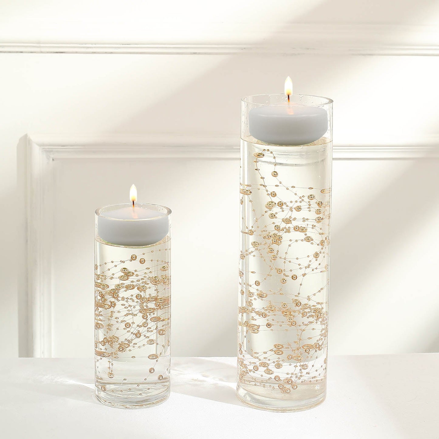 Rose gold vase filler for floating candles in elegant table centerpiece.