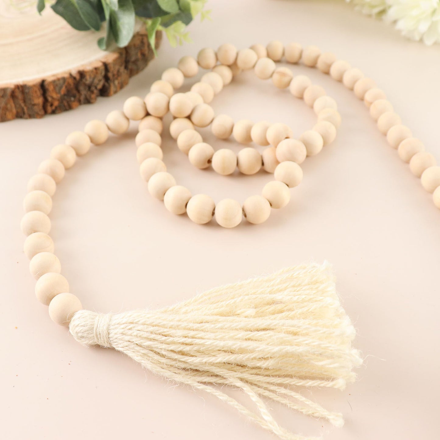 Cream rustic boho chic wood bead garland with tassels.