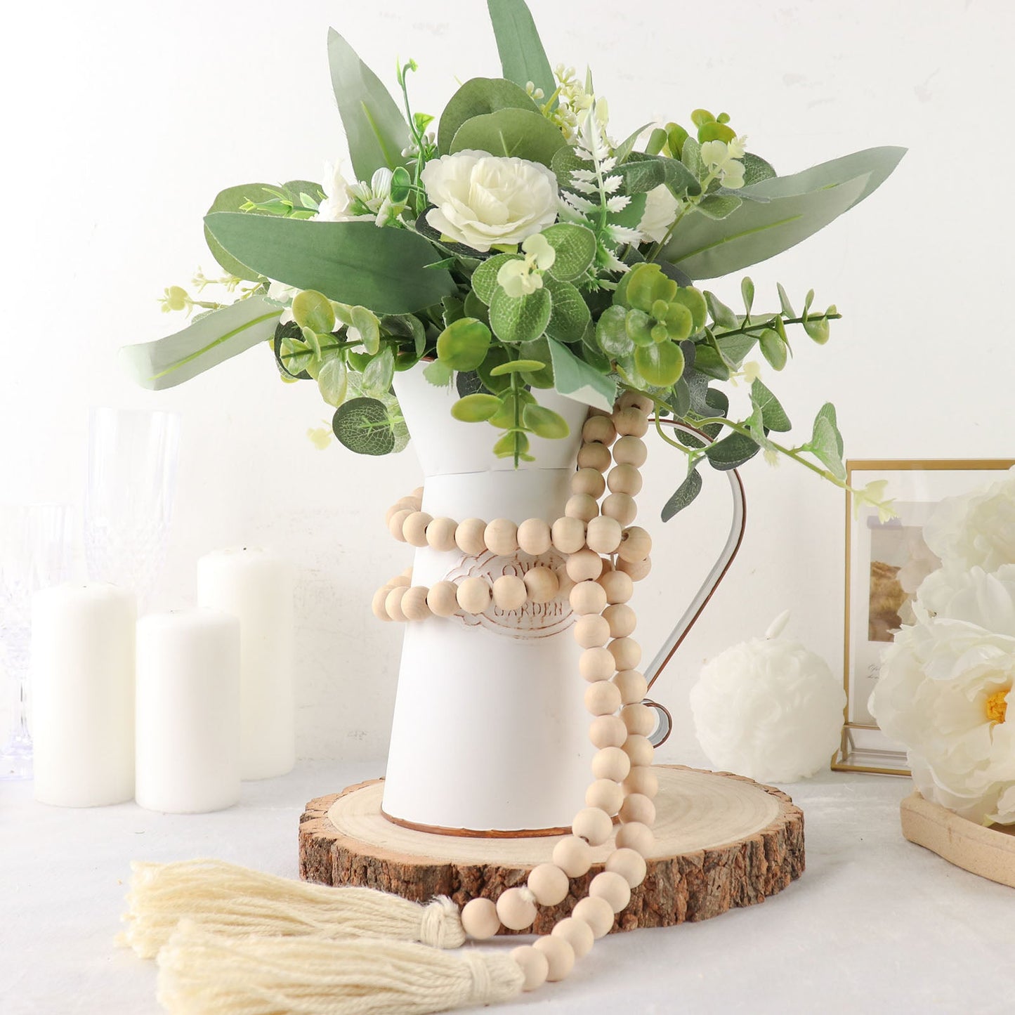 Cream rustic boho chic wood bead garland with tassels and farmhouse style.