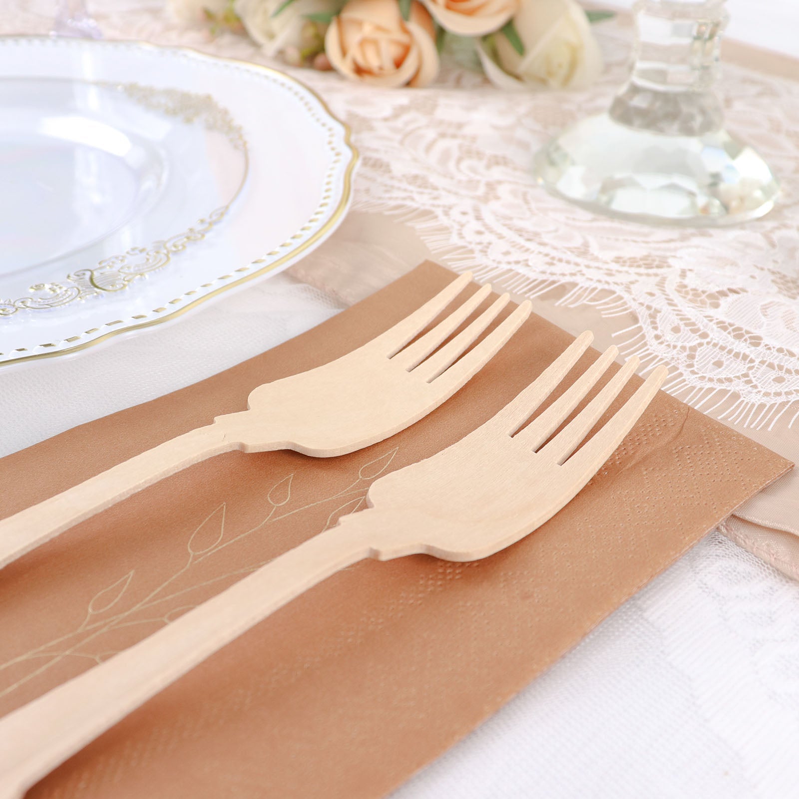 Eco-friendly biodegradable wooden forks in a vintage baroque design.