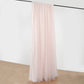 Blush chiffon polyester event curtain drapes hanging on a rod.