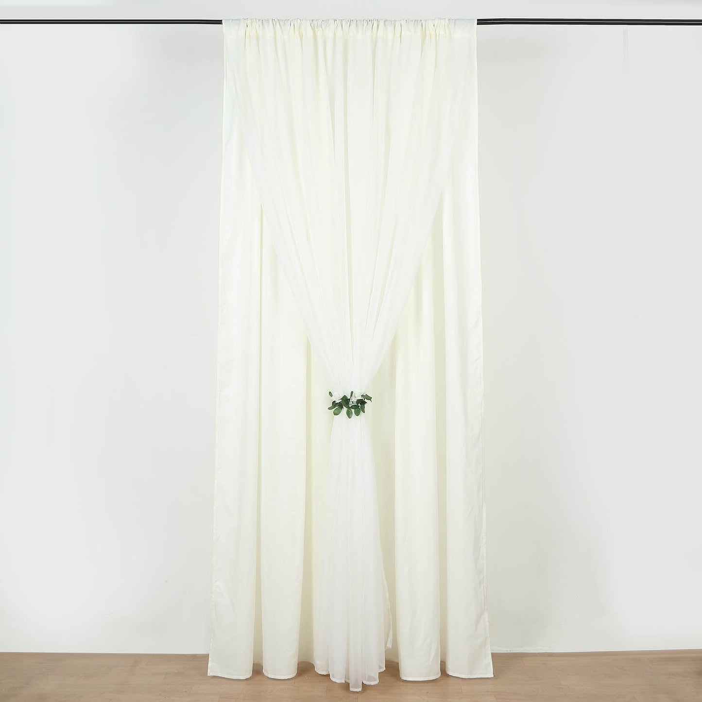 Ivory chiffon polyester event curtain drapes with dual layers.
