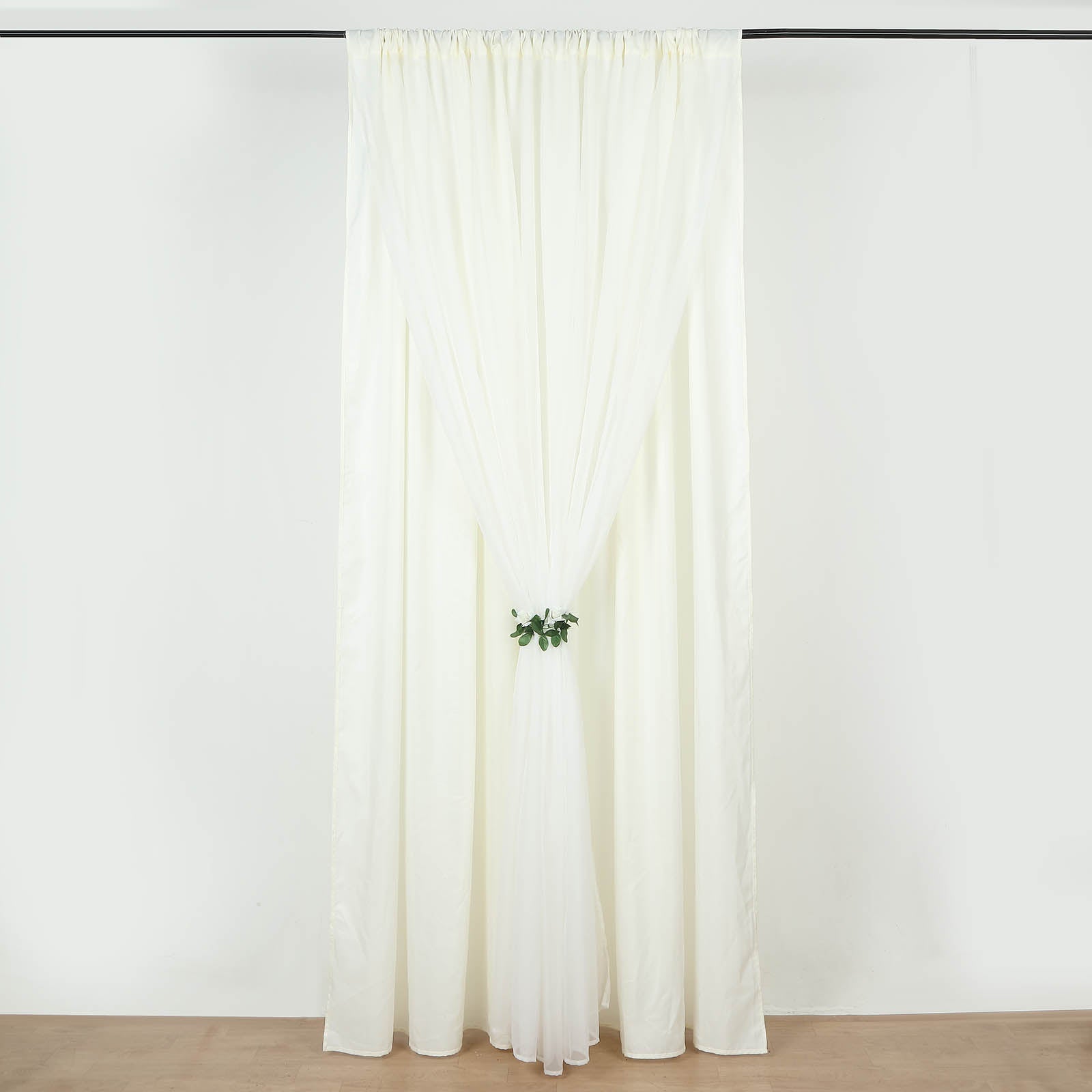 Ivory chiffon polyester event curtain drapes with dual layers.