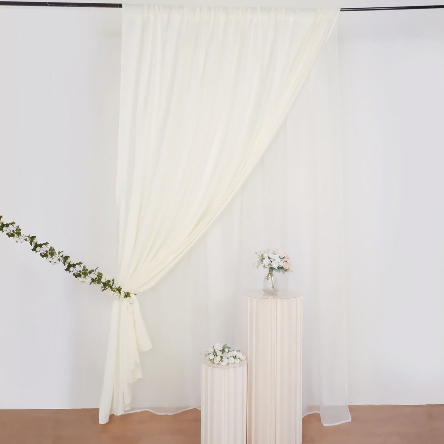 Ivory chiffon curtain drapes, perfect for event decor and backdrops.