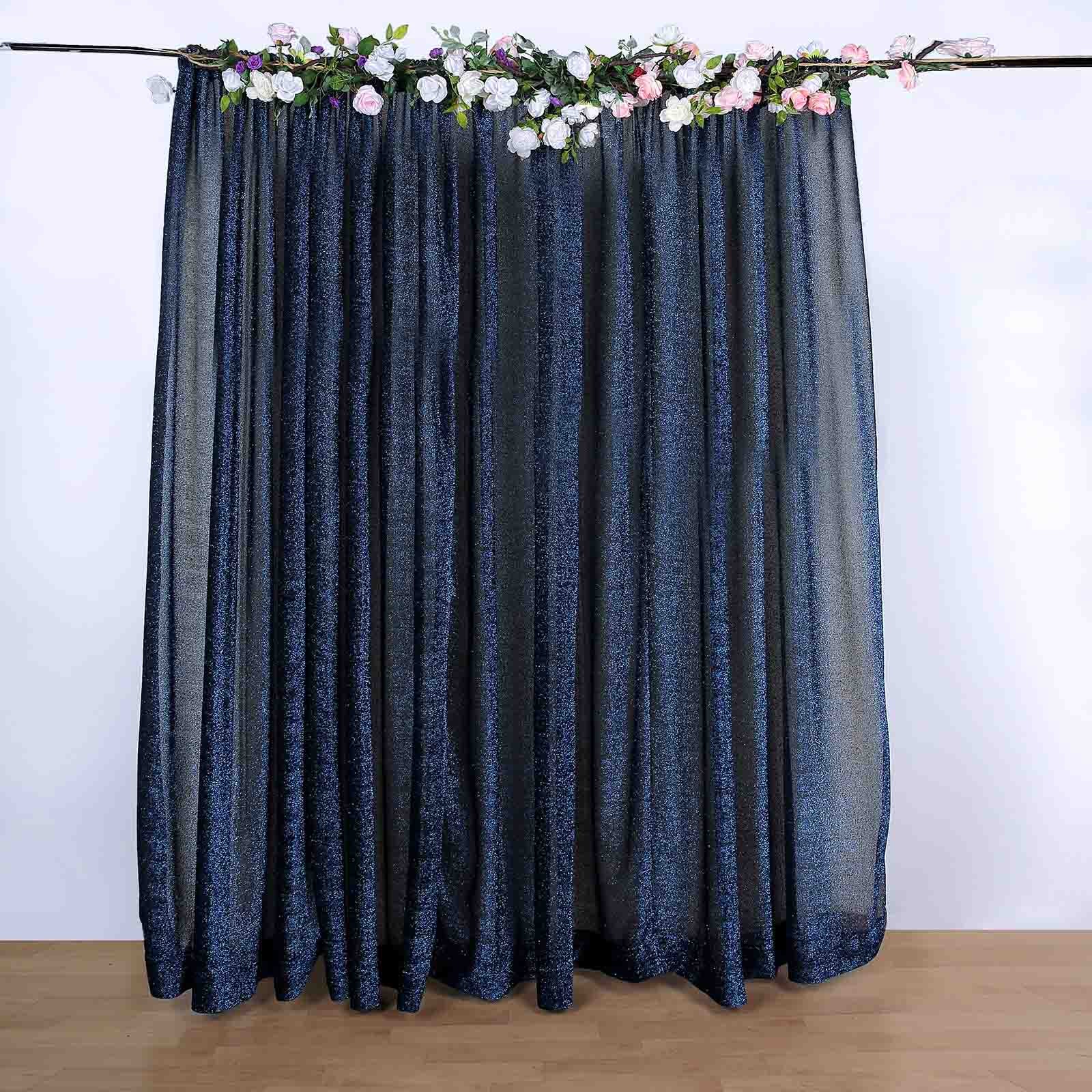 Navy blue metallic shimmer tinsel event curtain drapes with floral accents.