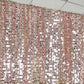 Blush sequin event curtain drapes for elegant backdrops.