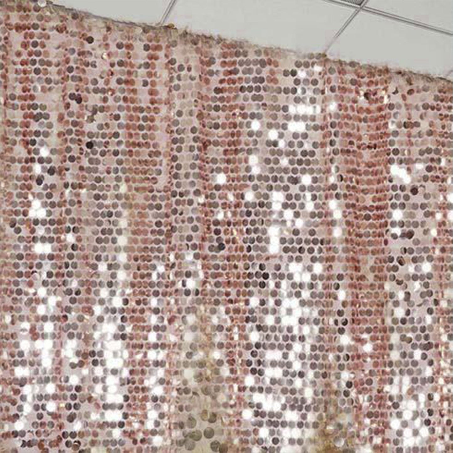 Blush sequin event curtain drapes for elegant backdrops.
