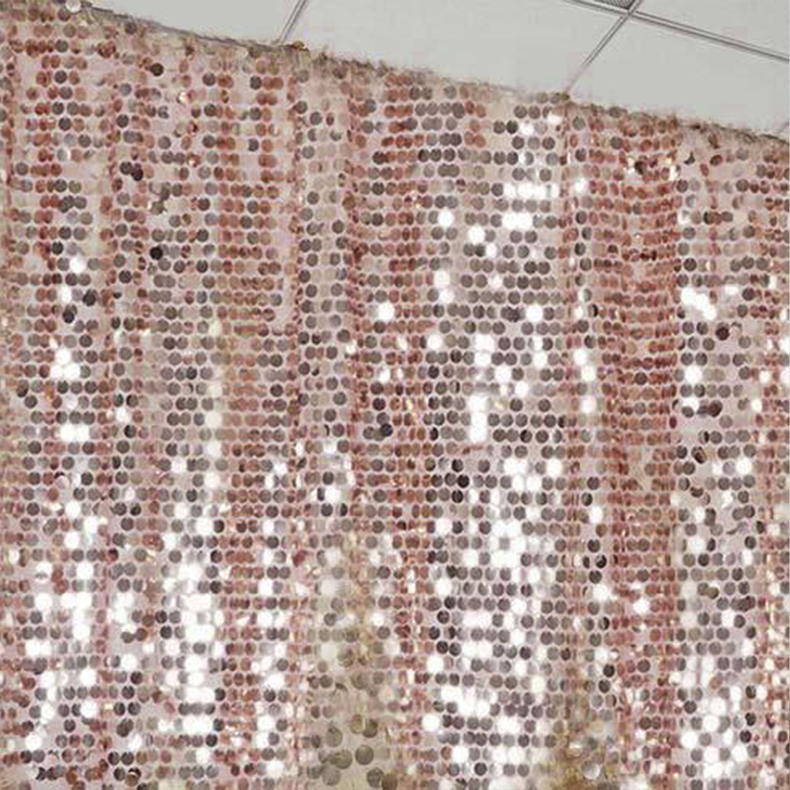 Blush sequin event curtain drapes for elegant backdrops.