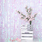 Iridescent big Payette sequin backdrop with pink flowers in a white crate.