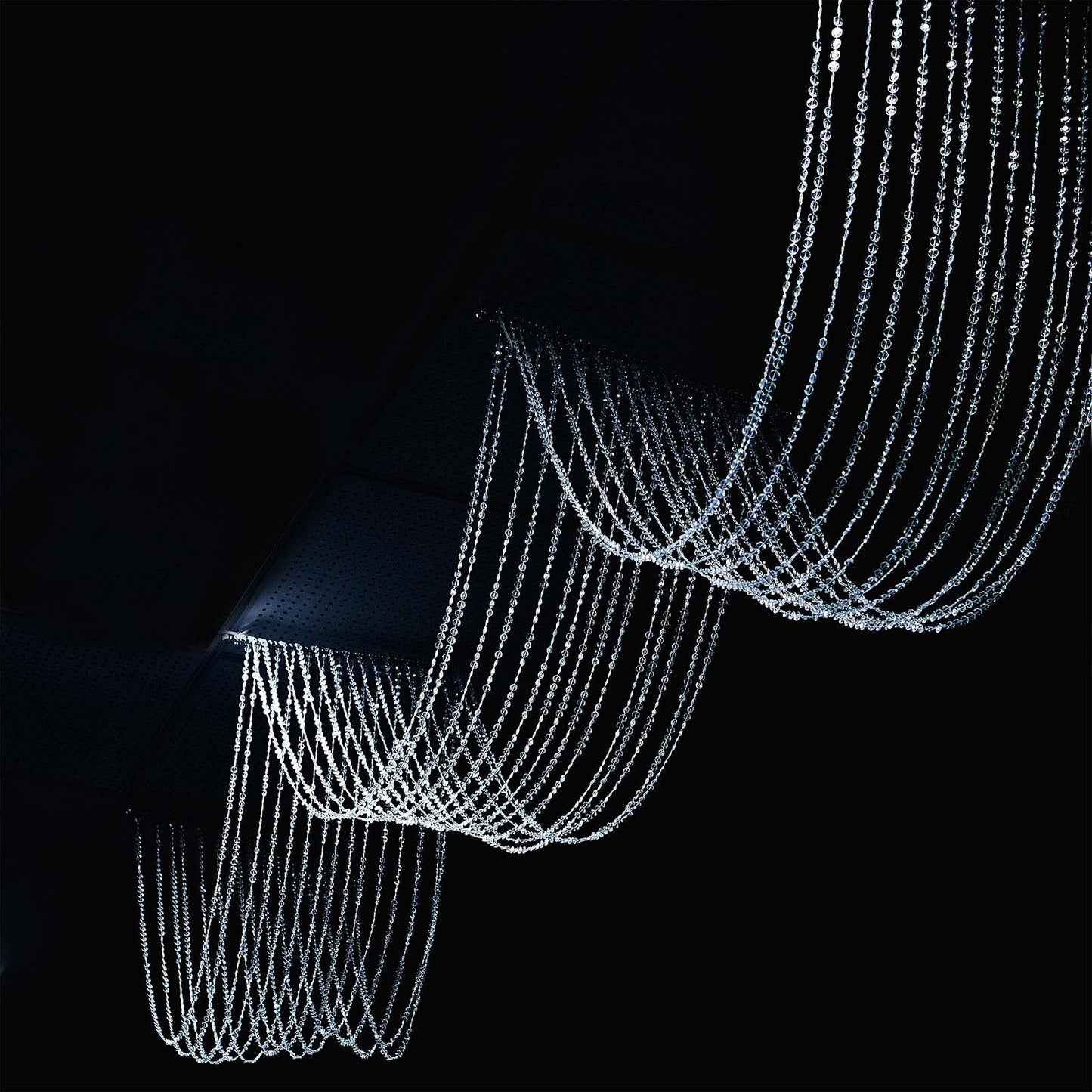 Crystal beaded ceiling drape curtains in clear color.