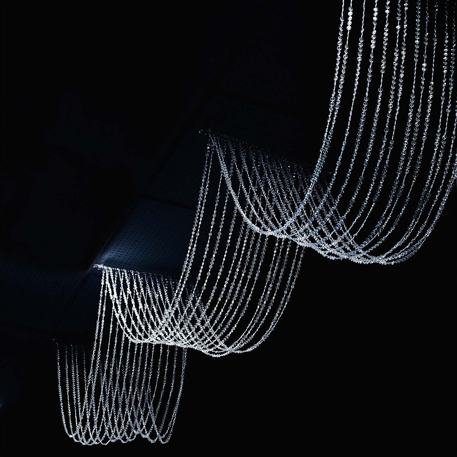 Crystal beaded ceiling drape curtains in clear color.