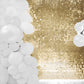 Ritzy gold sequin wall backdrop with white balloon decorations.