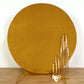 Metallic gold velvet round wedding arch cover with gold candle holders.