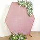 Rose gold metallic shimmer hexagon backdrop with floral accents.