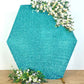 Turquoise metallic shimmer hexagon backdrop with floral accents.