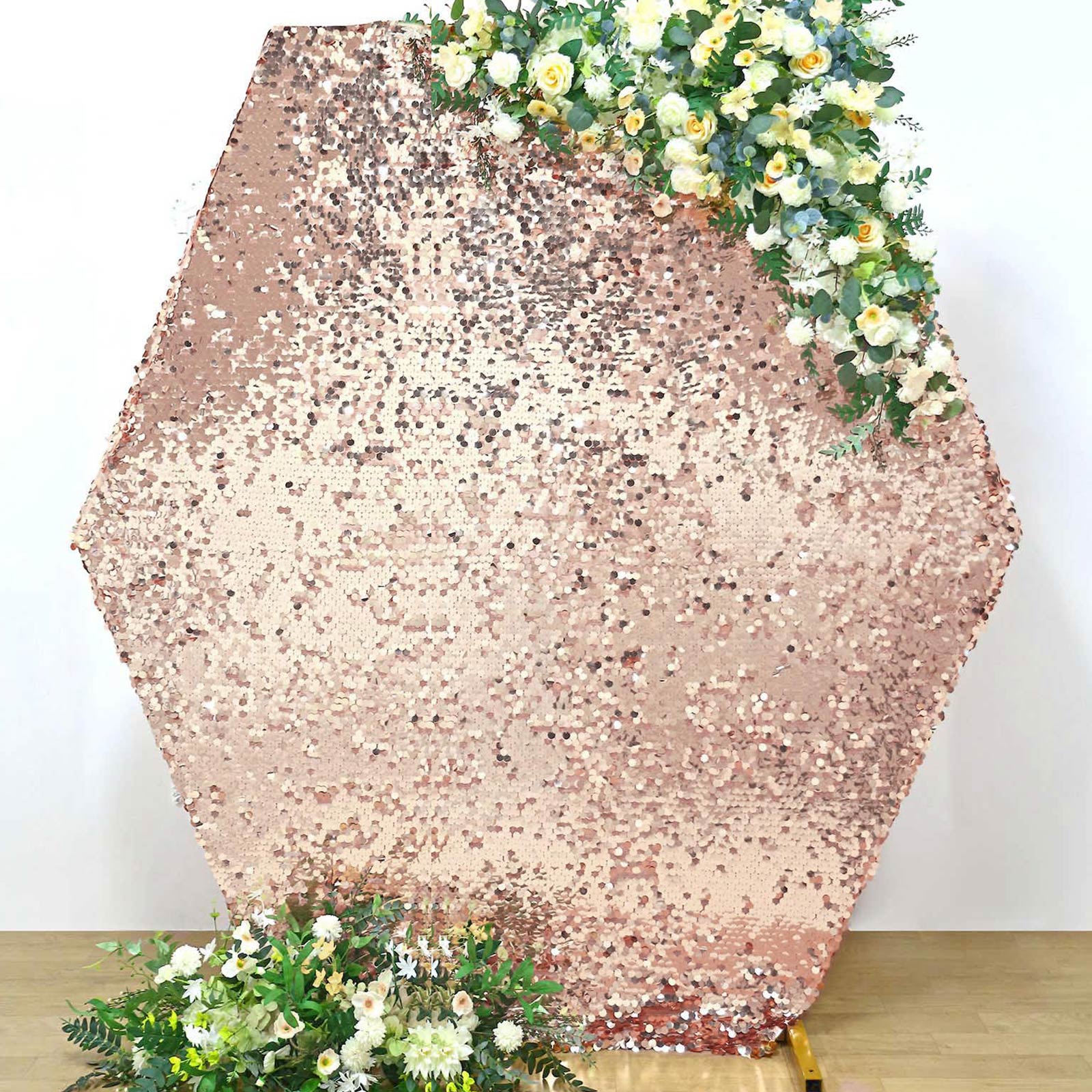 Rose gold sequin hexagon wedding arch cover with floral accents.