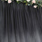 Black satin event curtain drapes backdrop panel for elegant occasions.