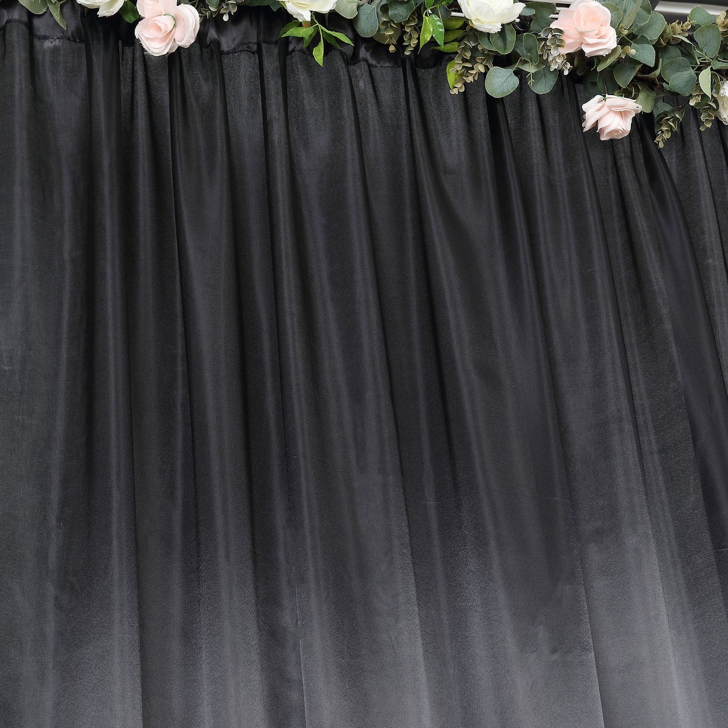 Black satin event curtain drapes backdrop panel for elegant occasions.