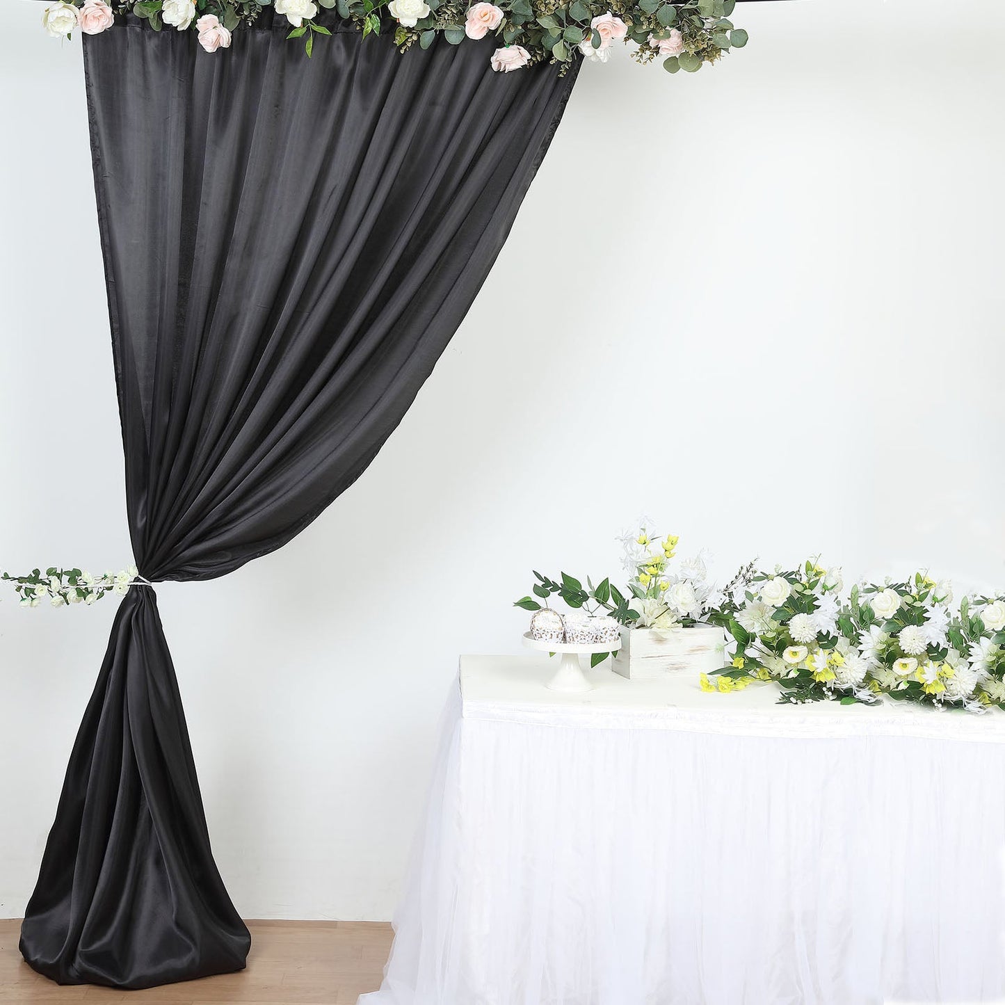 Black satin event curtain drapes, backdrop panel for elegant occasions.