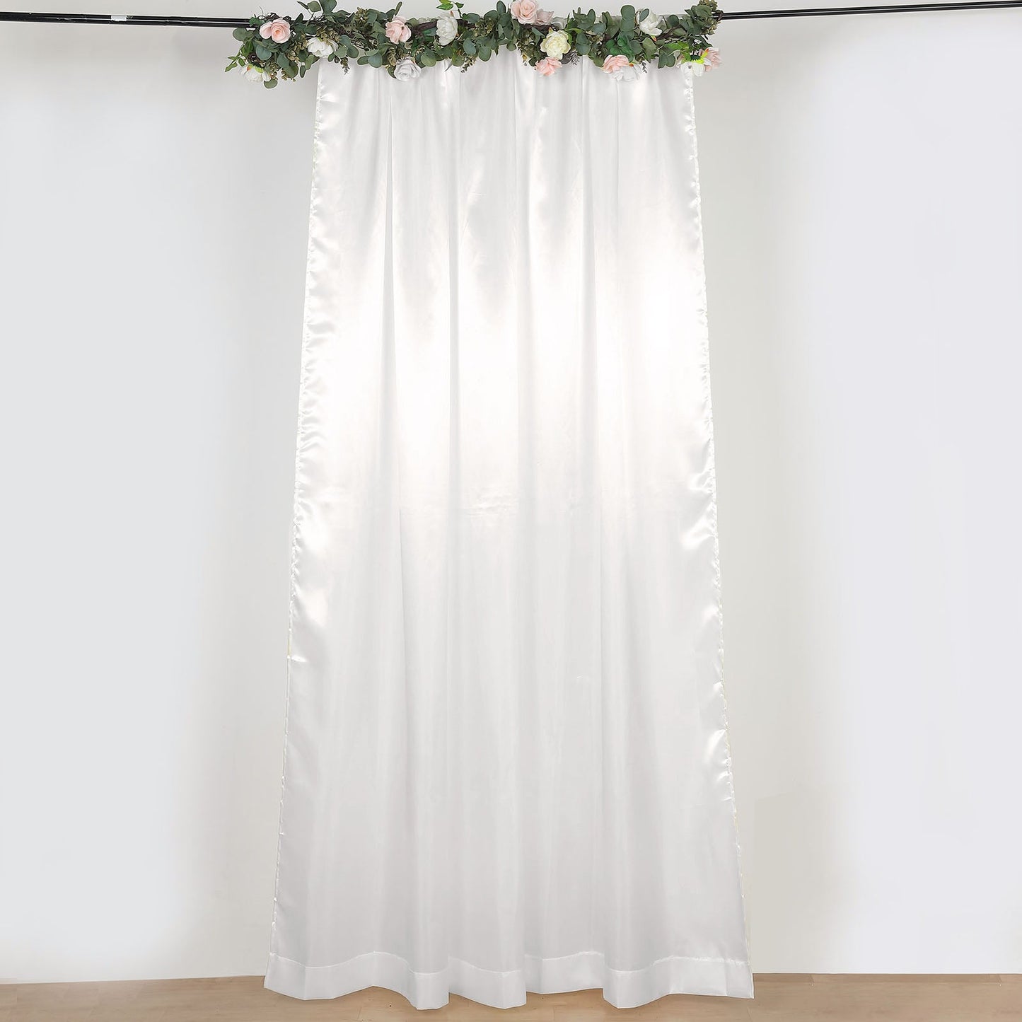 Ivory satin event curtain drapes, perfect for backdrops and celebrations.