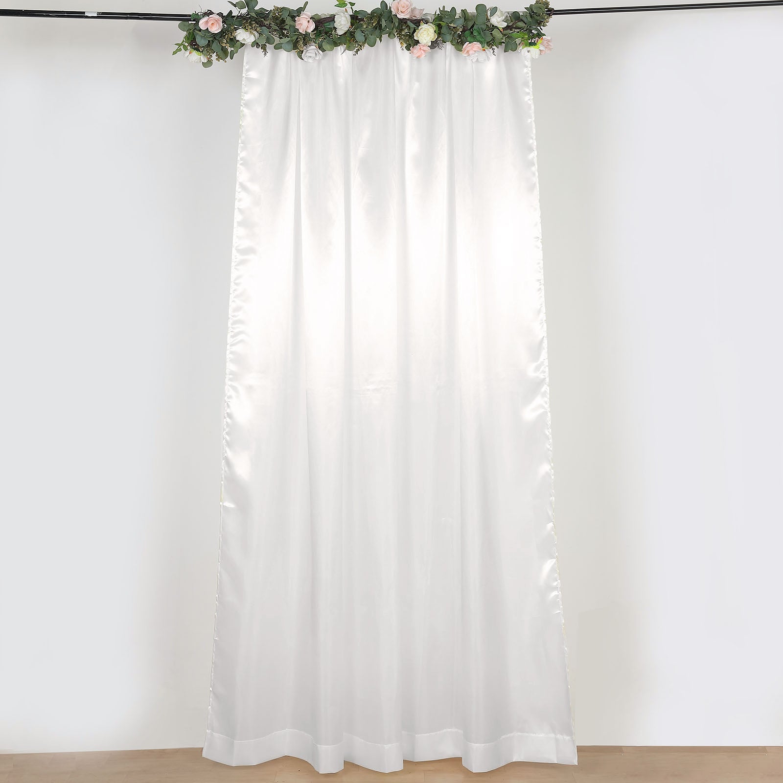 Ivory satin event curtain drapes, perfect for backdrops and celebrations.