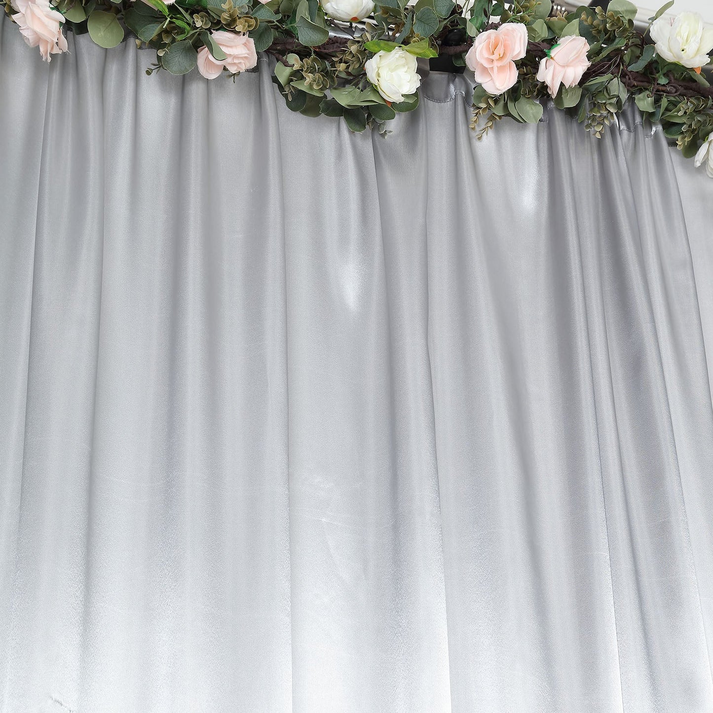 Silver satin event curtain drapes backdrop panel for elegant occasions.