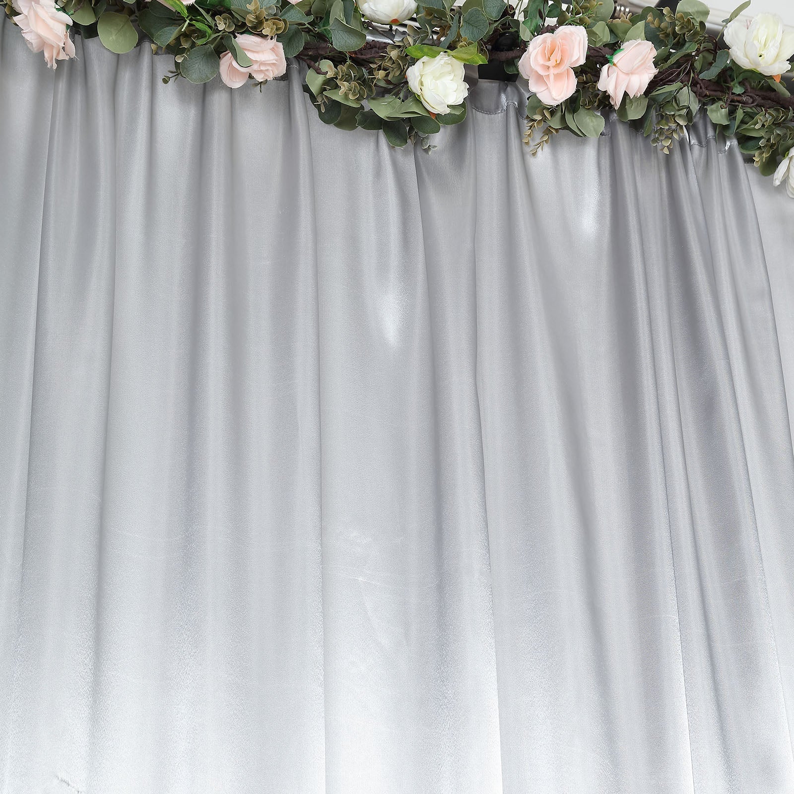 Silver satin event curtain drapes backdrop panel for elegant occasions.