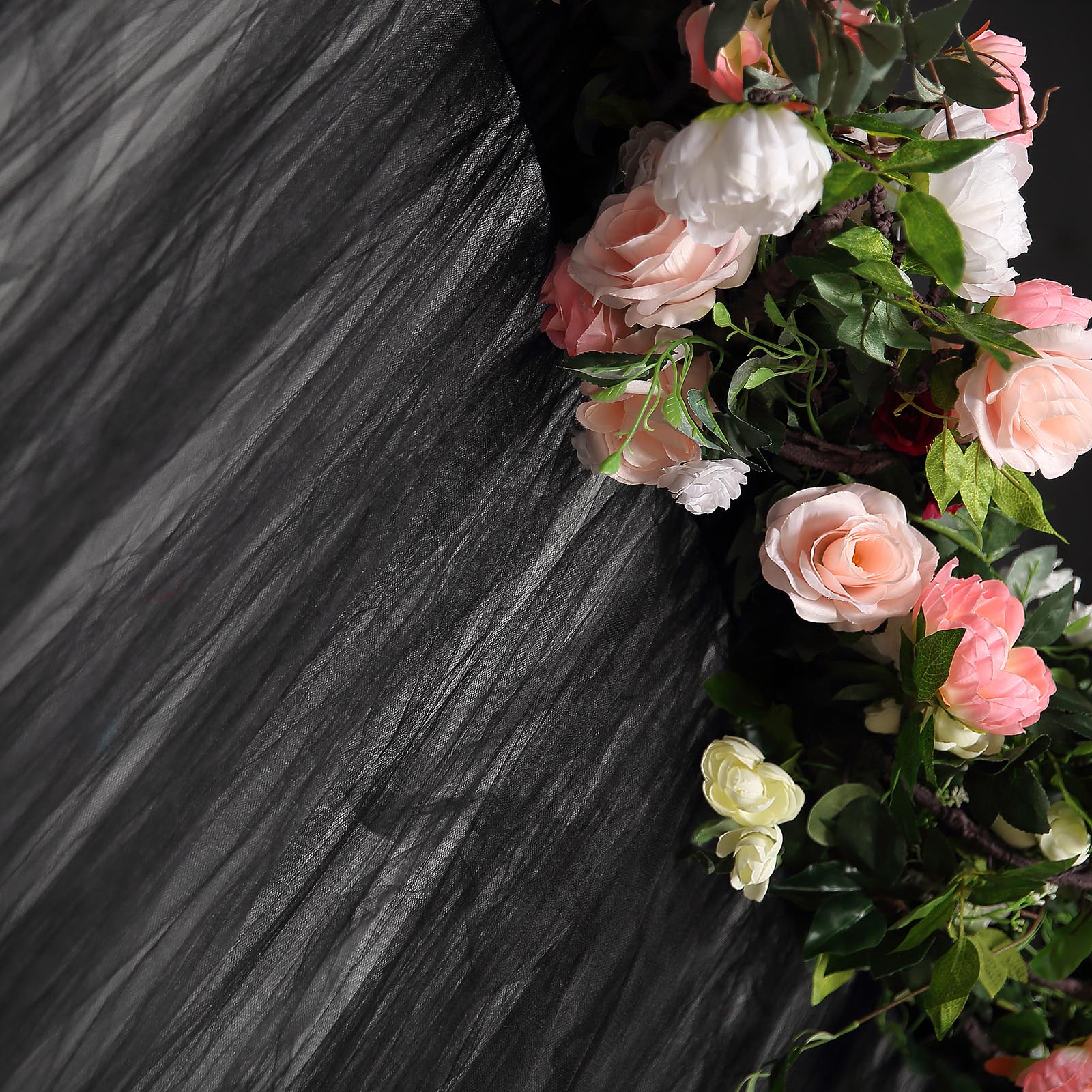 Black sheer tulle event curtain drapes with floral accents.