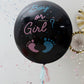 Black balloon with blue and pink confetti for gender reveal.