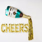 Champagne bottle and glass mylar foil balloon in teal and gold.