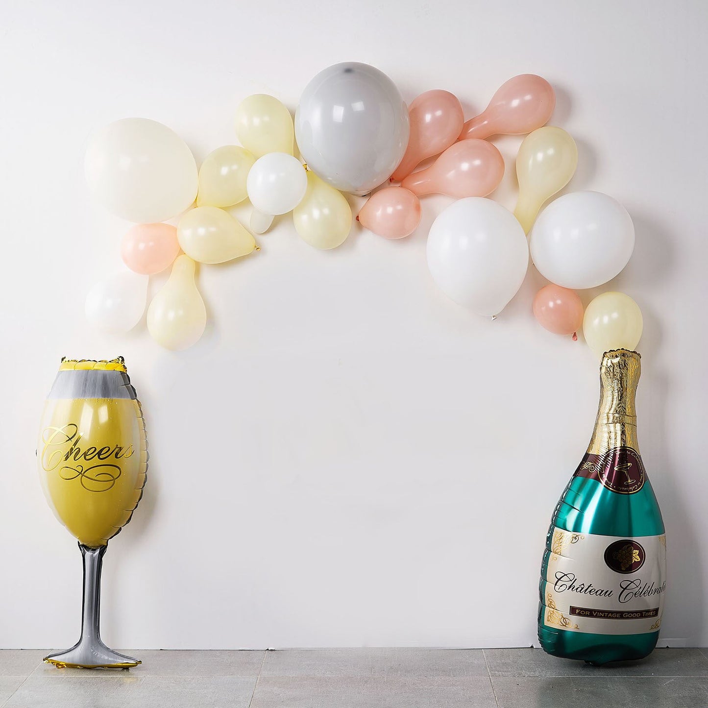 Champagne bottle and glass balloons in champagne and pastel colors.