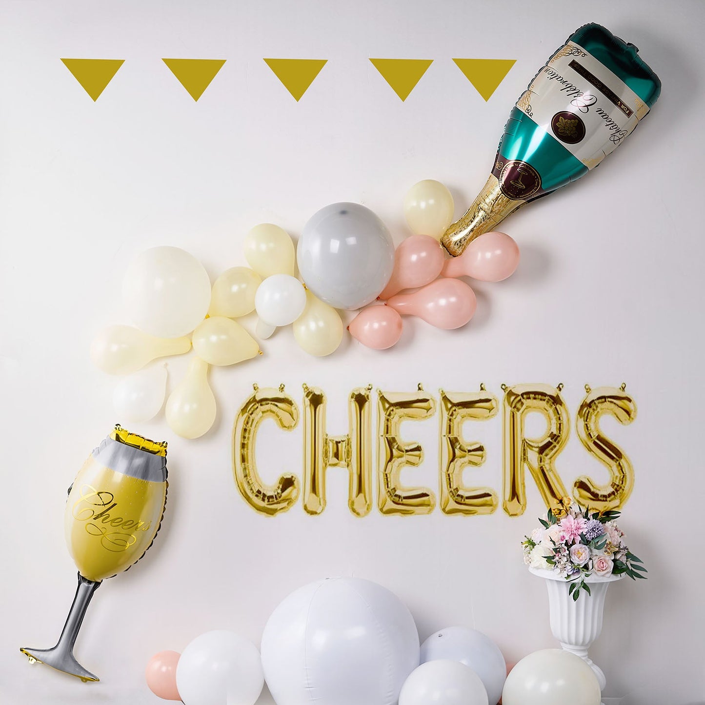 Champagne color balloons and decorations for celebration party.