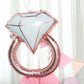 Rose gold diamond ring mylar foil balloon.