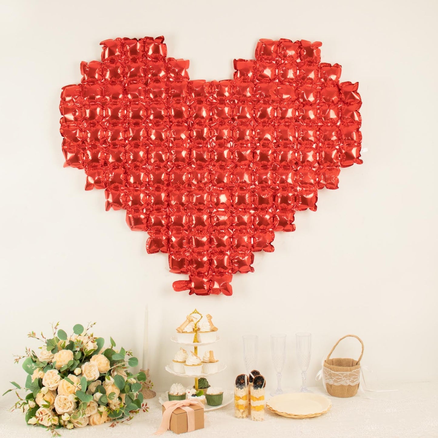 Metallic red extra large heart mylar foil balloon backdrop quilt.