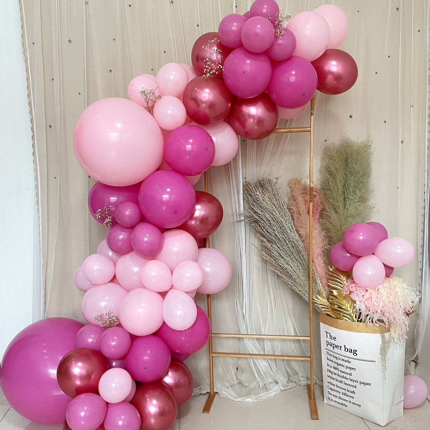 Rose gold, blush, and pink balloon garland arch party kit.