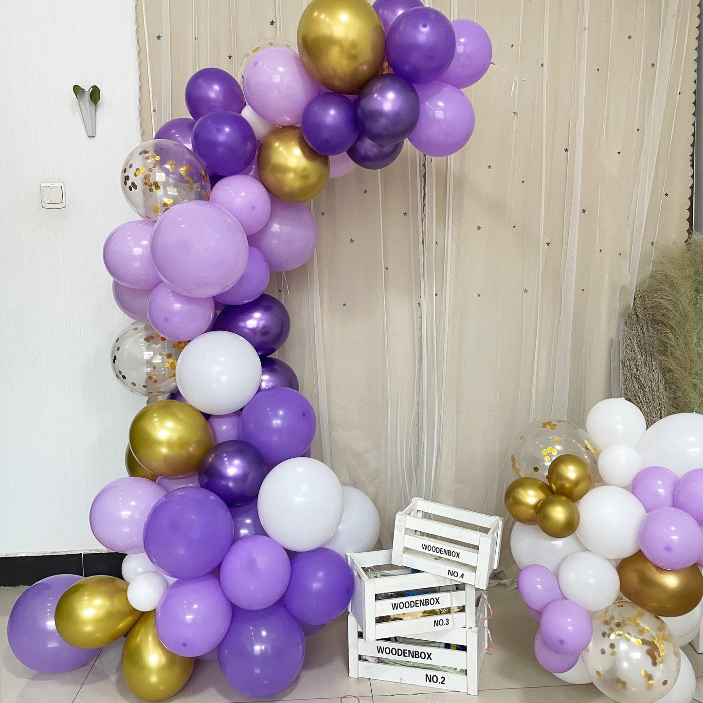 Purple, white, gold balloon garland arch party kit for celebrations.