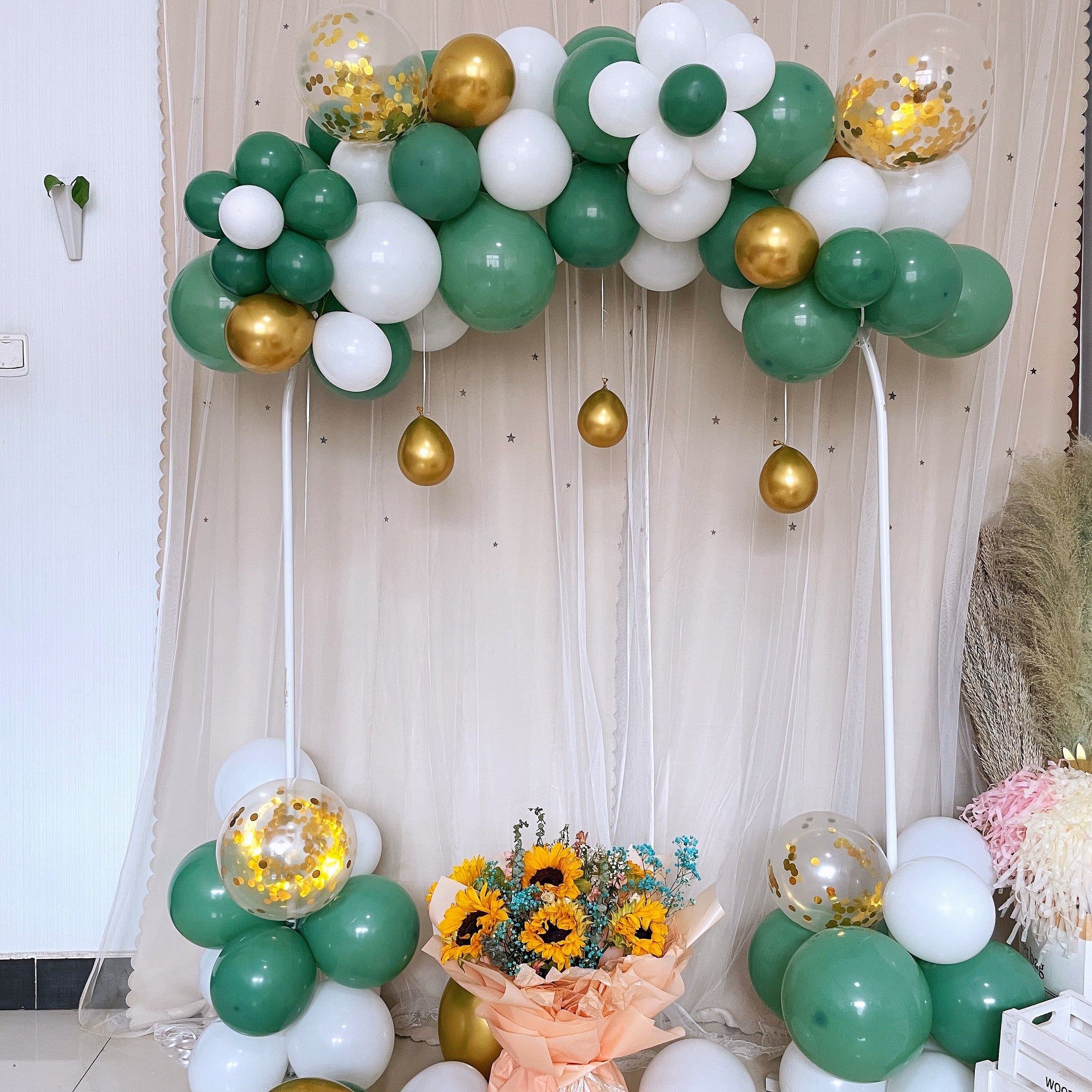 Green and gold balloon garland arch party kit with clear and white accents.