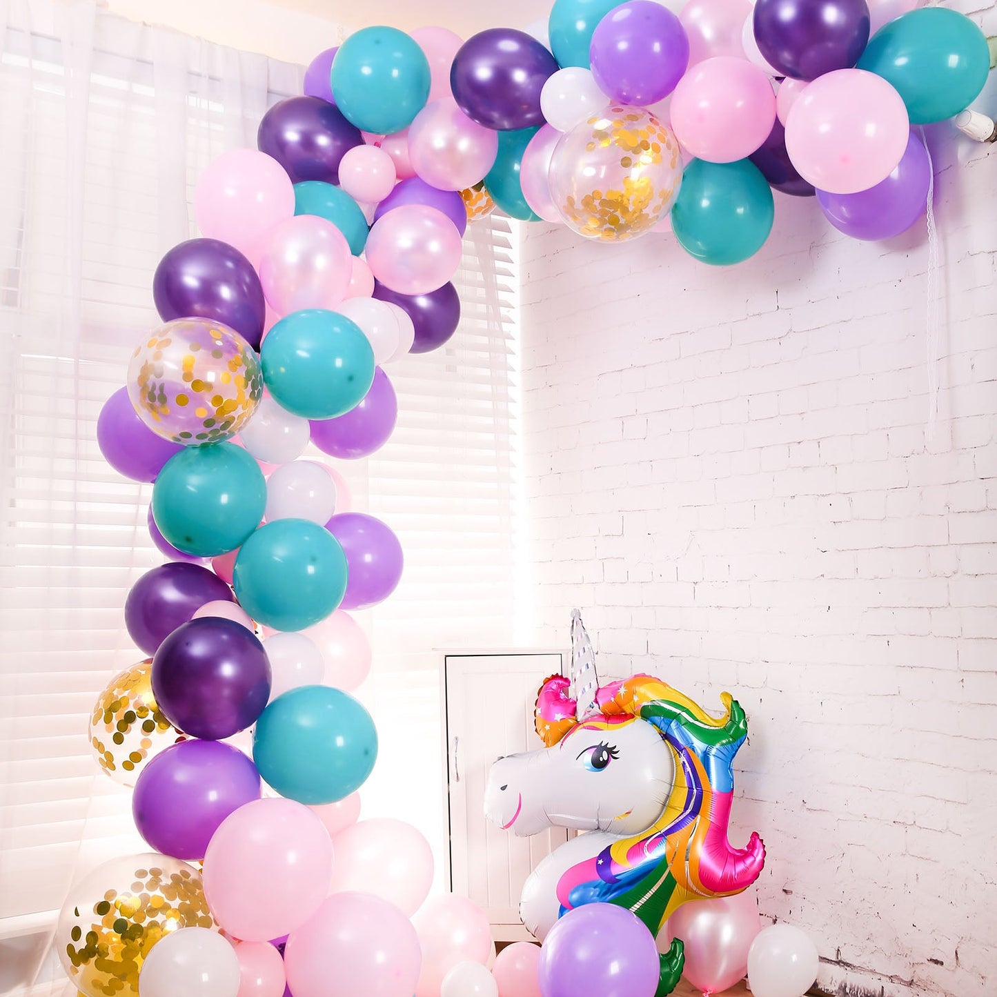 Turquoise, purple, and pink unicorn balloon garland arch kit.
