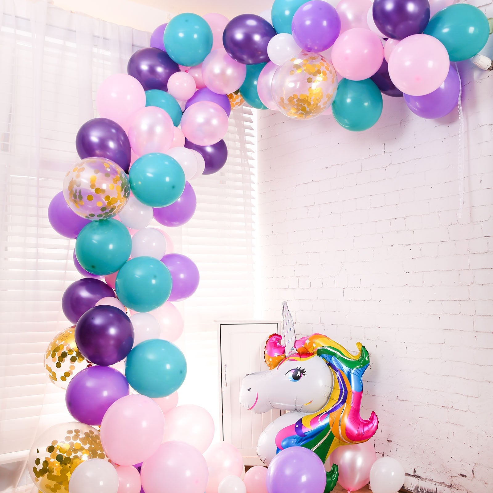 Turquoise, purple, and pink unicorn balloon garland arch kit.