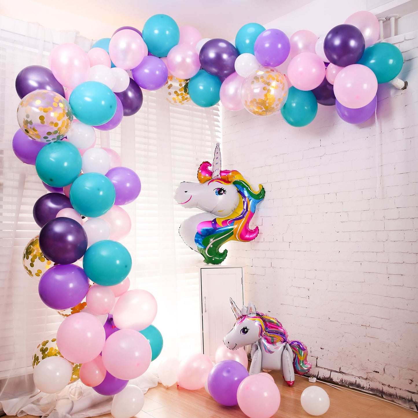 Turquoise, purple, and pink unicorn balloon garland arch kit.