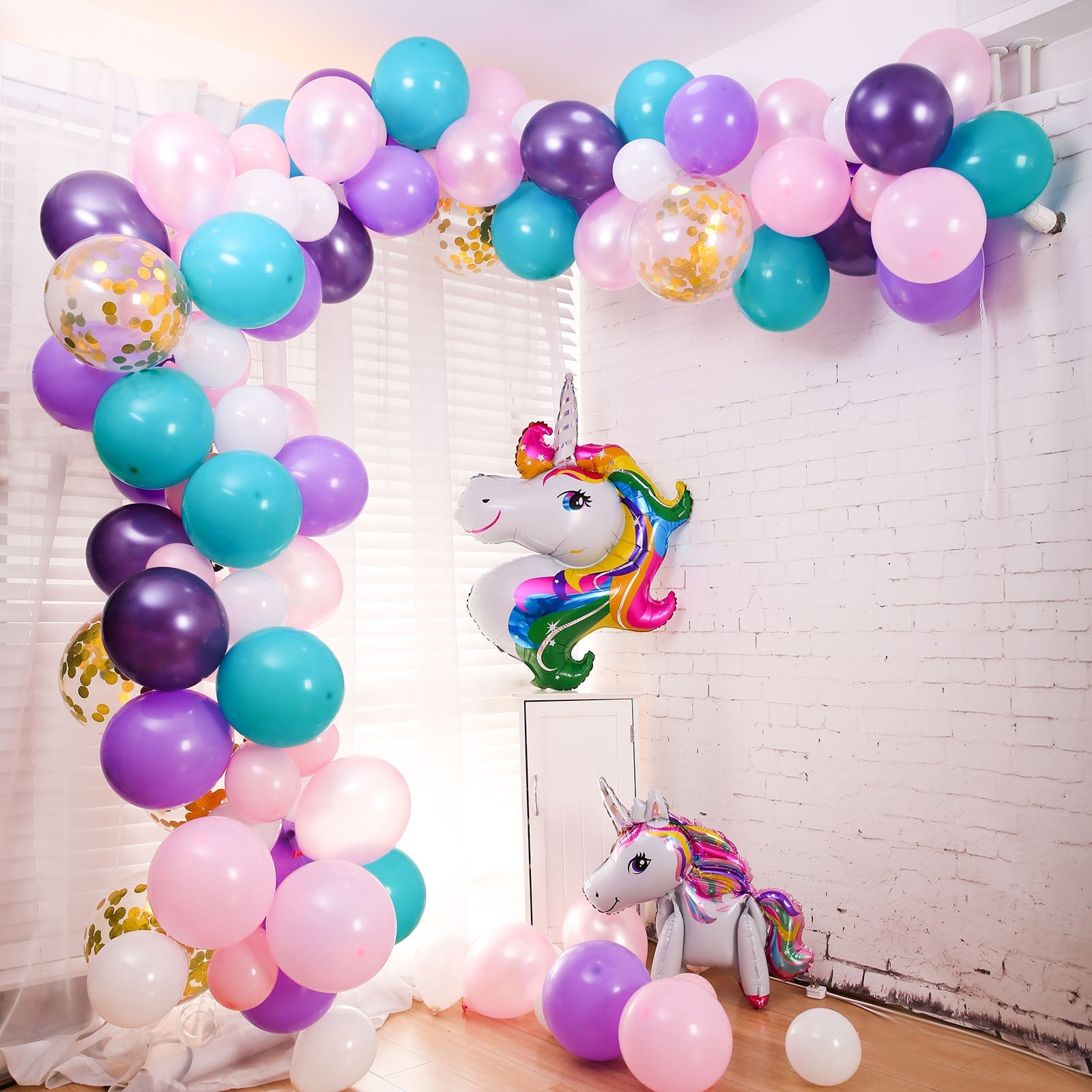 Turquoise, purple, and pink unicorn balloon garland arch kit.