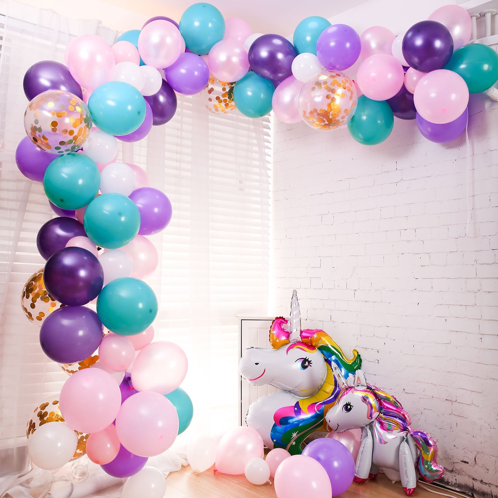 Turquoise, purple, and pink unicorn balloon garland arch kit.