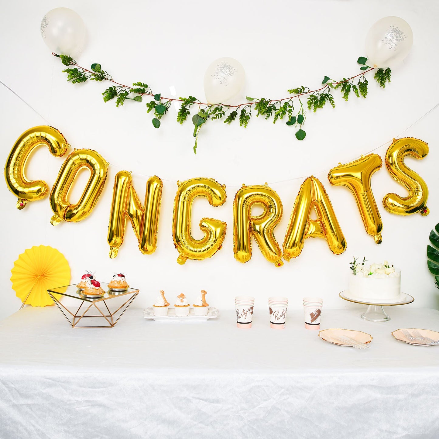 Shiny gold "Congrats" Mylar foil balloon banner sign.