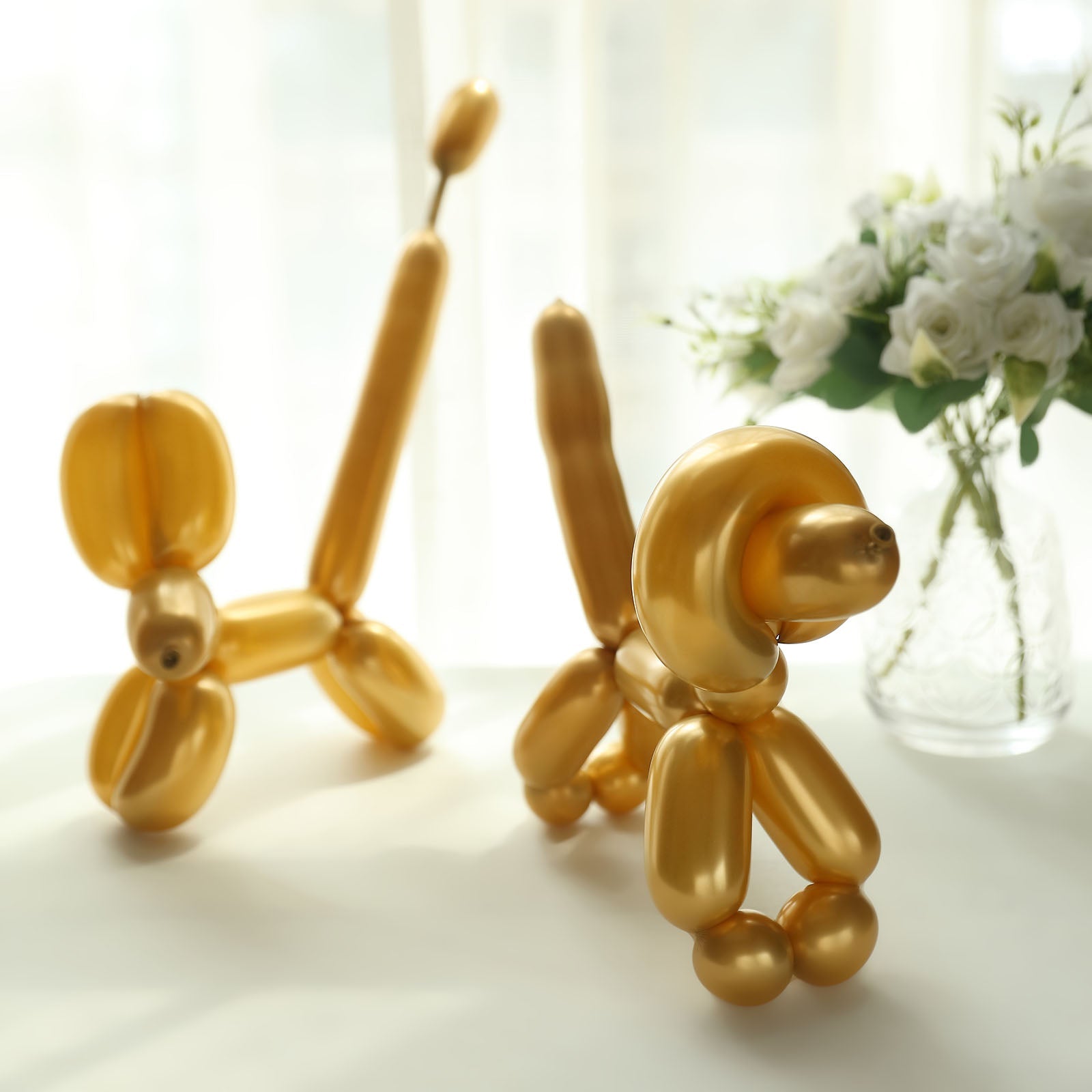 Assorted metallic gold long balloons for animal modeling and parties.
